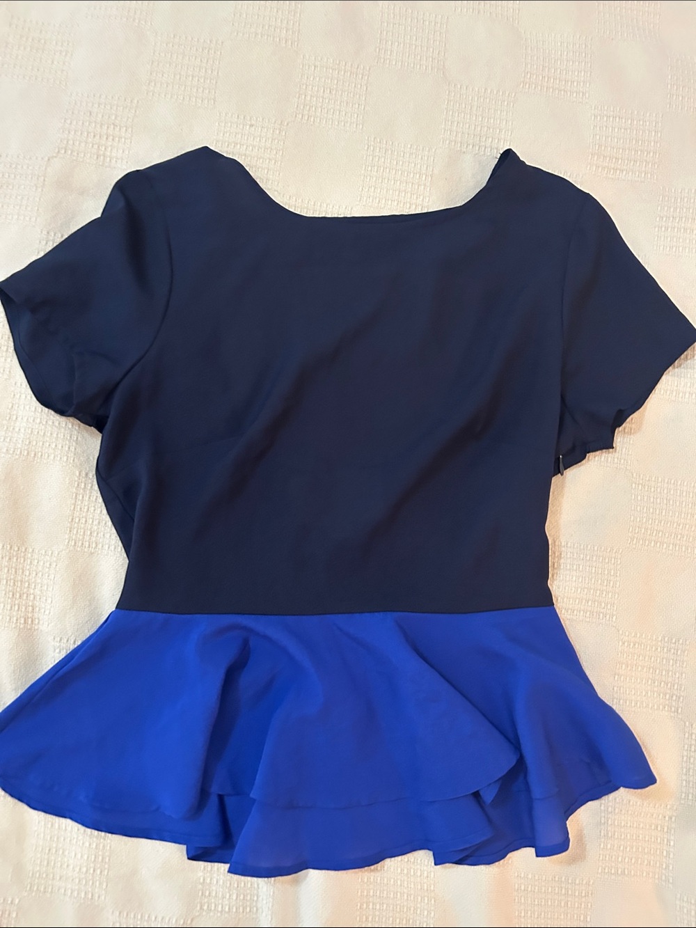 Rory Beca navy and royal blue colorblock peplum top featuring a short-sleeve